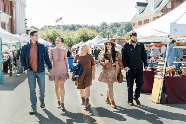 friends outside at a fall festival