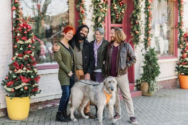 friends shopping with a dog during winter