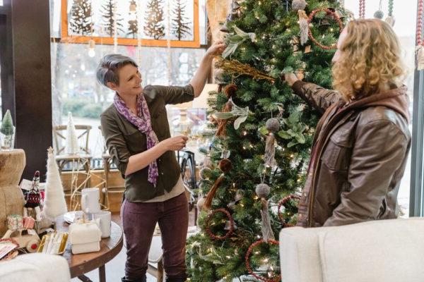 Friends admiring a christmas tree