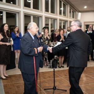 Paul Nealey presenting 2022 Citizen of the Year award to Trent Sanford.